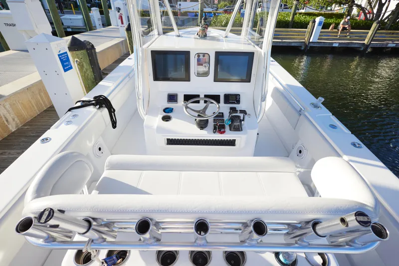  Yacht Photos Pics 2014 Contender 39 ST boat interior with helm, dual screens, and rod holders.
