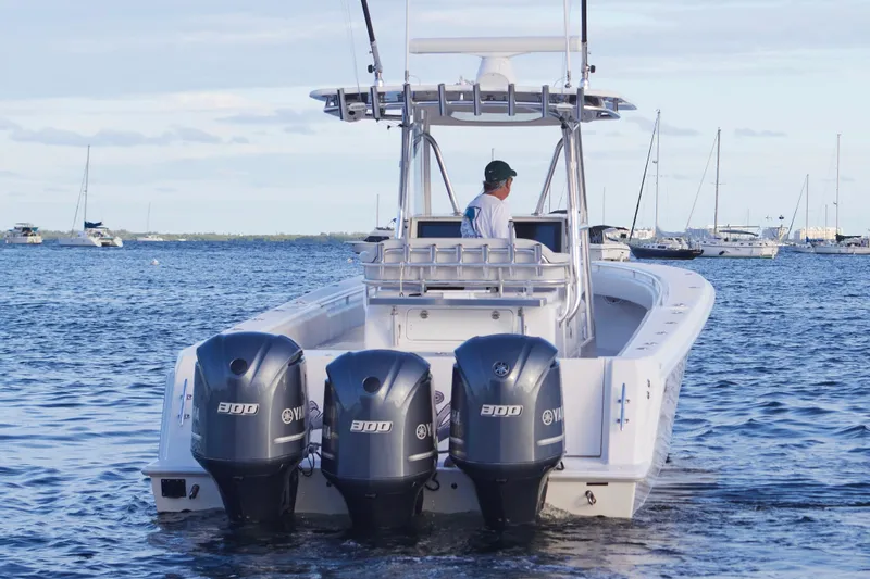  Yacht Photos Pics 2014 Contender 39 ST boat with triple Yamaha engines on the water.