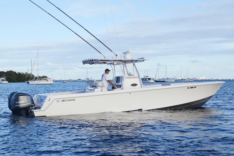  Yacht Photos Pics 2014 Contender 39 ST boat cruising on a calm sea with Yamaha engines.