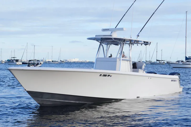  Yacht Photos Pics 2014 Contender 39 ST boat on calm water with other boats in the background.