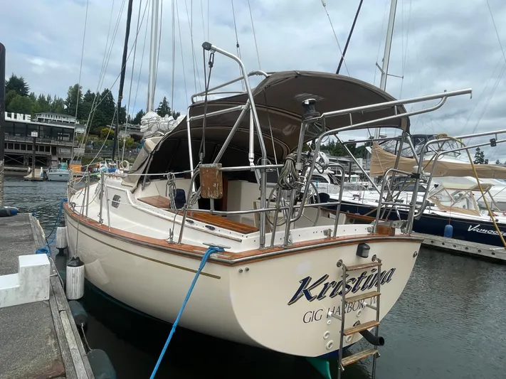  Yacht Photos Pics 1995 Island Packet 40 sailboat docked at marina, overcast sky, named "Kristina."