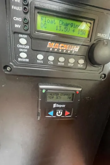  Yacht Photos Pics Control panel on a 1995 Island Packet 40 sailboat, displaying charging and heater settings.