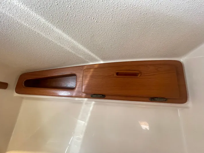  Yacht Photos Pics Wooden cabinet detail inside 1995 Island Packet 40 sailboat, featuring a sleek design.