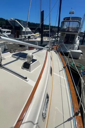  Yacht Photos Pics Island Packet 40 sailboat, 1995 model, docked at marina under clear blue sky.