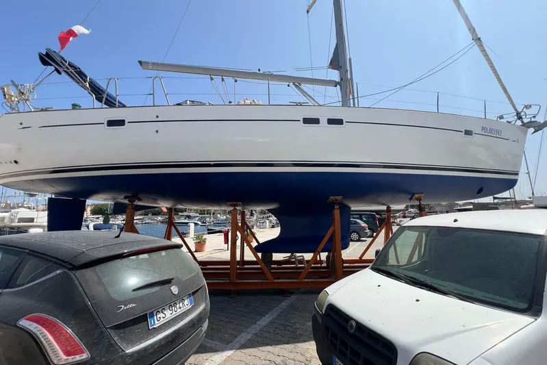 Roberto Goracci Yacht Photos Pics 2003 Beneteau Oceanis Clipper 473 sailboat on stands in a marina parking area.