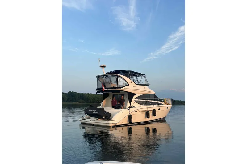  Yacht Photos Pics 2008 Meridian 391 Sedan yacht on calm water under a clear sky.