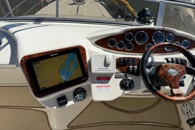  Yacht Photos Pics 2008 Meridian 391 Sedan dashboard with navigation system and steering wheel.