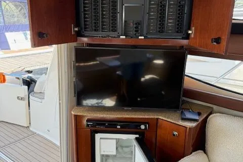  Yacht Photos Pics 2008 Meridian 391 Sedan interior with TV, control panel, and mini fridge.