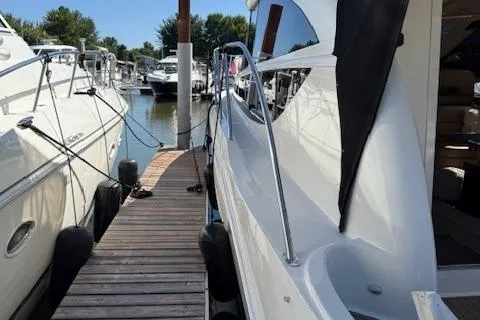  Yacht Photos Pics 2008 Meridian 391 Sedan yacht docked at marina, side view with walkway.