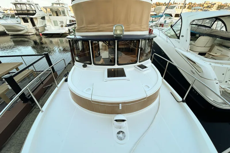  Yacht Photos Pics 2017 Ranger Tugs R-31 CB boat docked at marina, surrounded by other vessels.