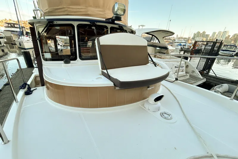  Yacht Photos Pics 2017 Ranger Tugs R-31 CB boat docked at marina, featuring spacious deck seating.