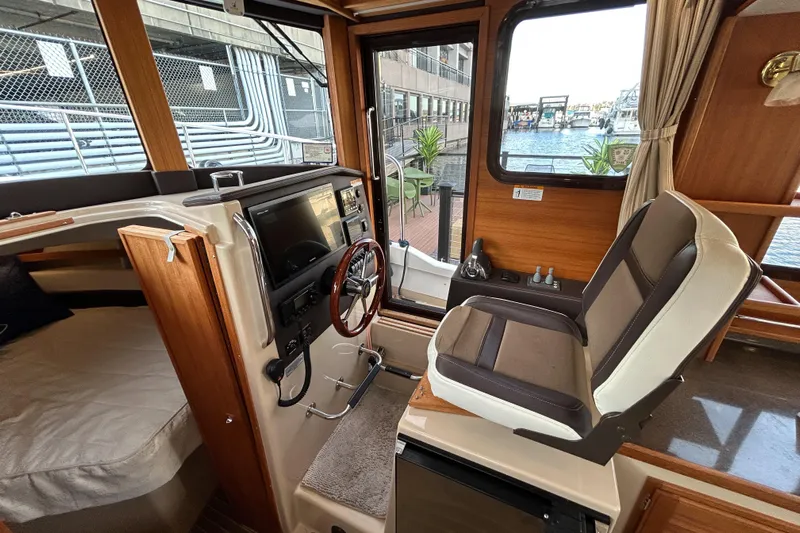  Yacht Photos Pics Interior of 2017 Ranger Tugs R-31 CB boat with helm station and seating.