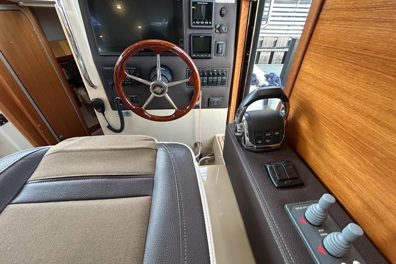  Yacht Photos Pics 2017 Ranger Tugs R-31 CB helm with wooden steering wheel and control panel.