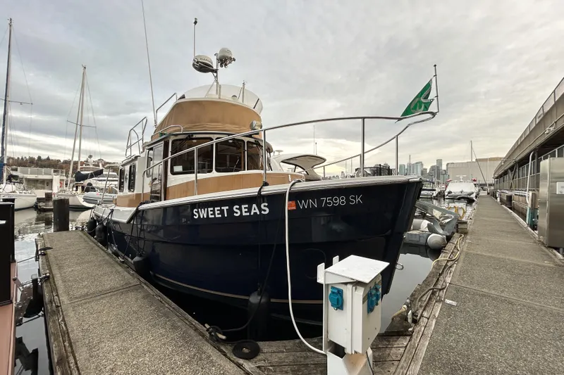  Yacht Photos Pics 2017 Ranger Tugs R-31 CB boat "Sweet Seas" docked at a marina.