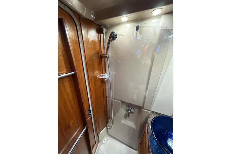  Yacht Photos Pics 2017 Ranger Tugs R-31 CB bathroom with shower and wooden accents.