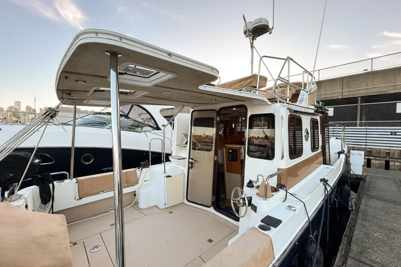  Yacht Photos Pics 2017 Ranger Tugs R-31 CB boat docked, featuring spacious deck and modern amenities.