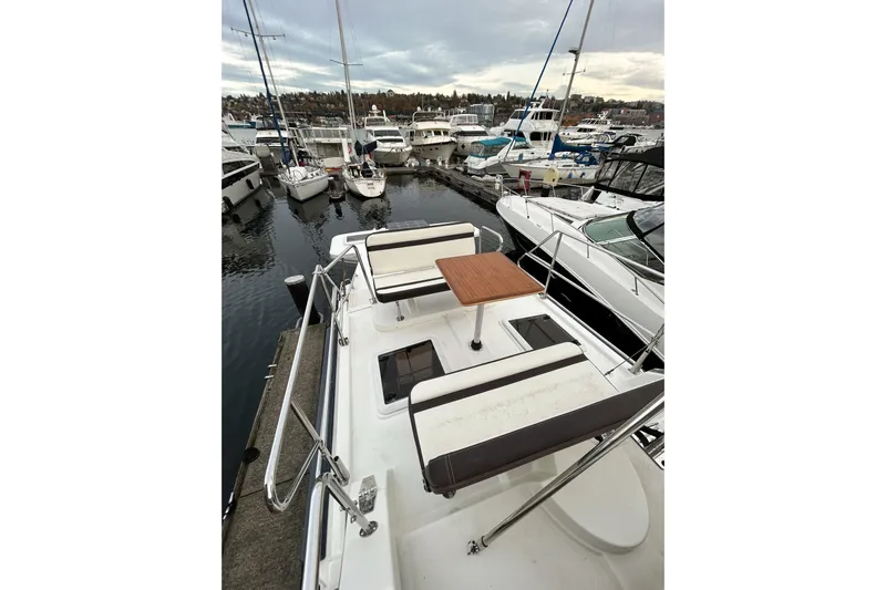  Yacht Photos Pics 2017 Ranger Tugs R-31 CB boat docked at marina with seating and table.