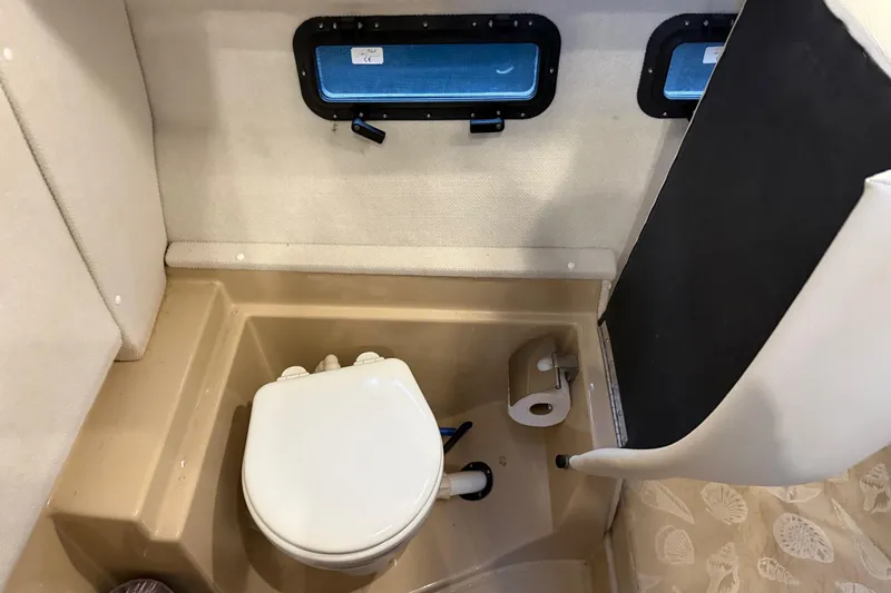  Yacht Photos Pics 2017 Ranger Tugs R-31 CB boat bathroom with toilet and window.