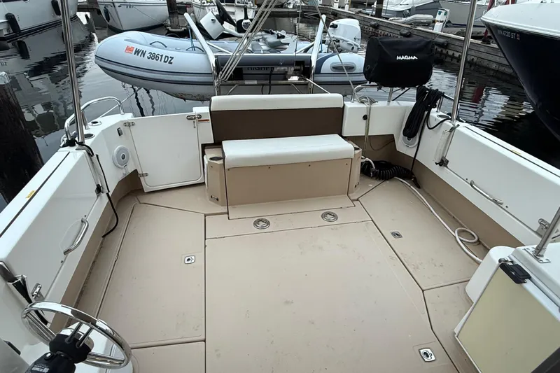  Yacht Photos Pics 2017 Ranger Tugs R-31 CB boat deck with seating and docked inflatable dinghy.