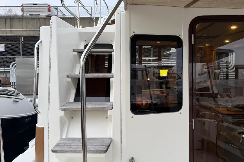  Yacht Photos Pics 2017 Ranger Tugs R-31 CB boat with exterior stairs and cabin entrance.