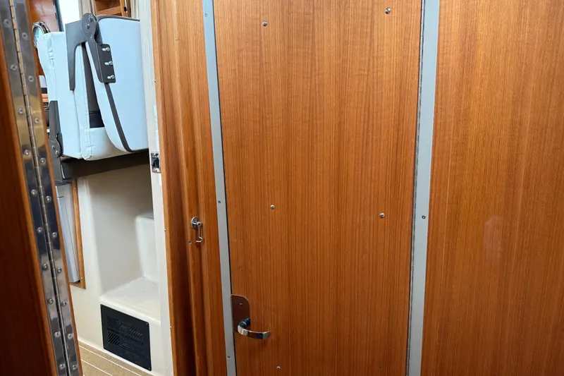  Yacht Photos Pics Interior of 2017 Ranger Tugs R-31 CB with wooden door and storage compartment.