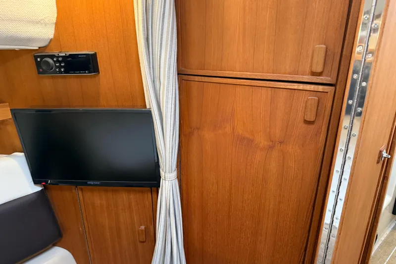  Yacht Photos Pics Interior of 2017 Ranger Tugs R-31 CB with TV, stereo, and wooden cabinetry.