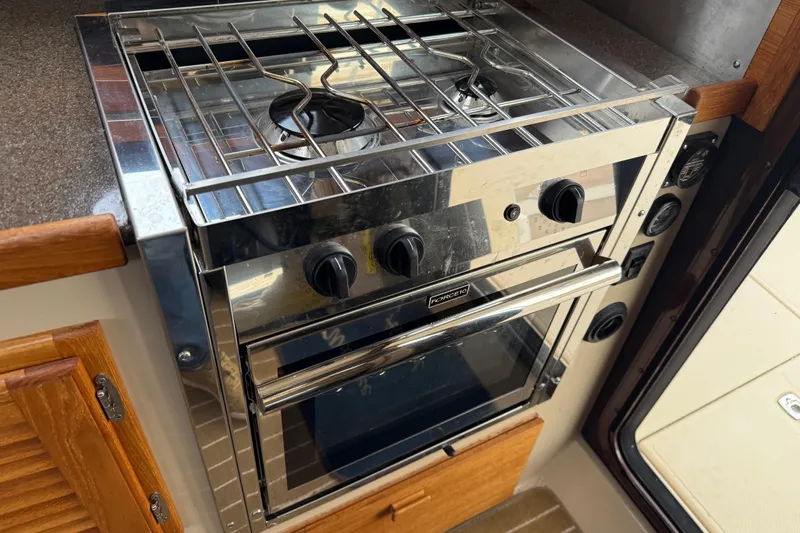  Yacht Photos Pics Stainless steel stove and oven in 2017 Ranger Tugs R-31 CB boat kitchen.