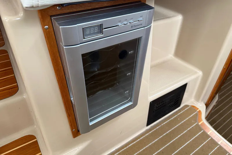  Yacht Photos Pics 2017 Ranger Tugs R-31 CB interior with Dometic fridge, wood accents, and steps.