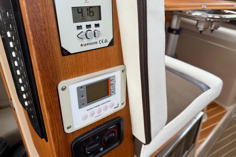  Yacht Photos Pics Control panel on 2017 Ranger Tugs R-31 CB boat interior, featuring digital displays and wood finish.