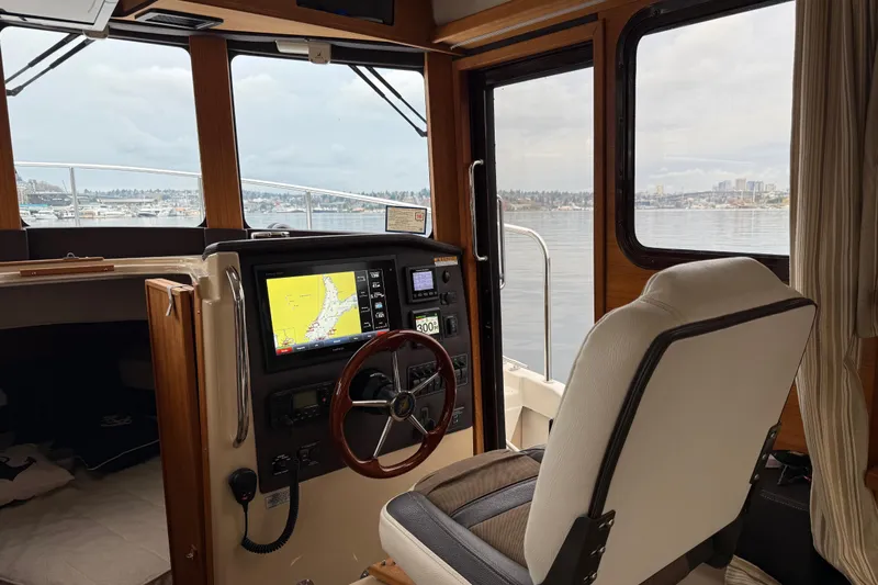  Yacht Photos Pics Interior view of 2017 Ranger Tugs R-31 CB boat cockpit with navigation system.