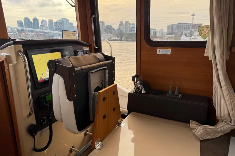  Yacht Photos Pics Interior view of 2017 Ranger Tugs R-31 CB with city skyline through window.