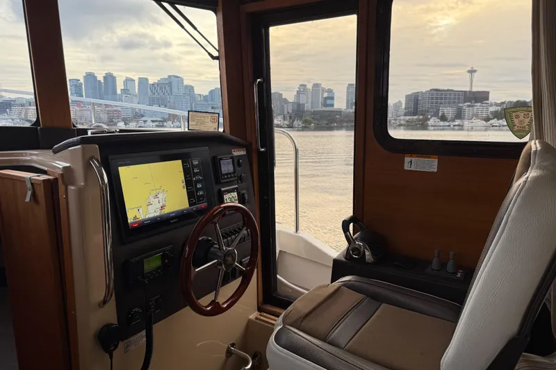  Yacht Photos Pics Interior of 2017 Ranger Tugs R-31 CB with city skyline view through window.