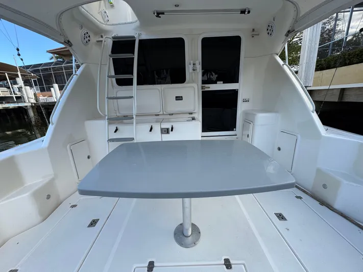  Yacht Photos Pics Riviera 40 Convertible 2002 yacht interior with table and seating area.