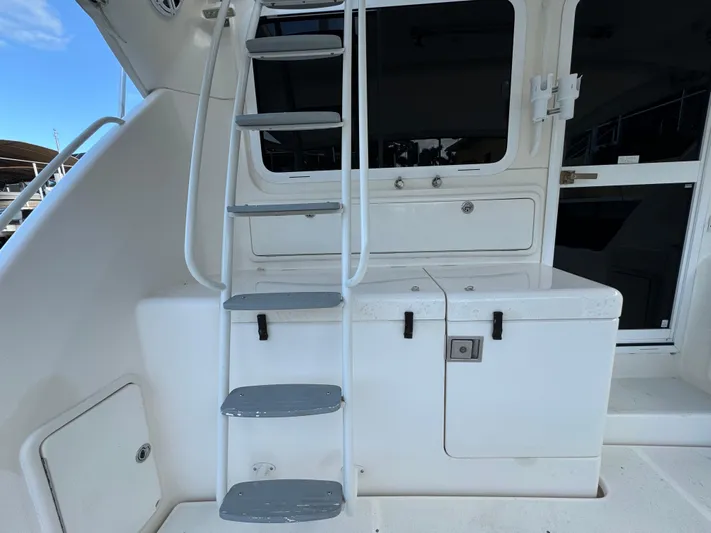  Yacht Photos Pics Riviera 40 Convertible 2002 yacht interior with ladder and storage compartments.