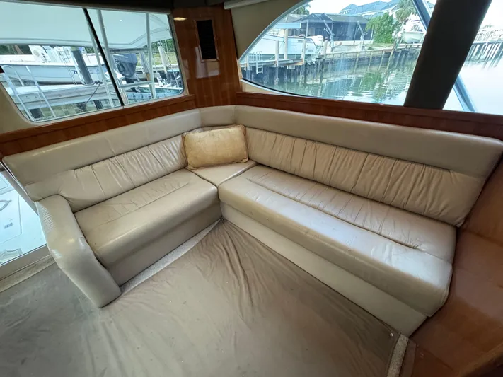 Yacht Photos Pics Luxurious interior of 2002 Riviera 40 Convertible yacht with beige leather seating.