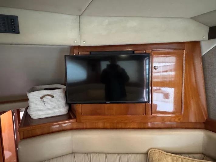  Yacht Photos Pics Interior of 2002 Riviera 40 Convertible with TV and storage basket.