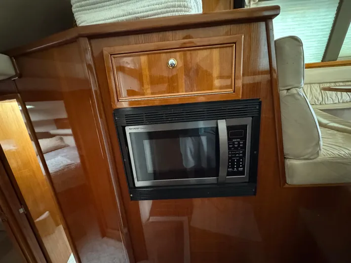  Yacht Photos Pics Microwave in 2002 Riviera 40 Convertible yacht interior with wooden cabinetry.
