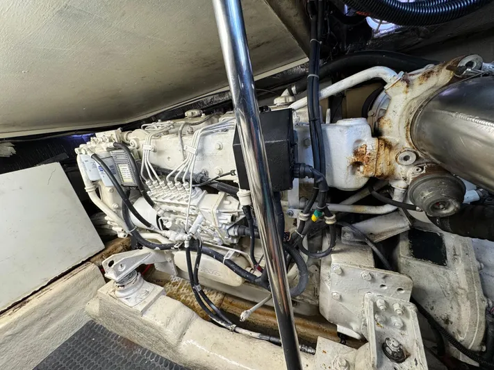  Yacht Photos Pics Engine compartment of a 2002 Riviera 40 Convertible boat, showcasing detailed mechanical components.