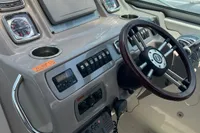 2009 Chaparral 290 Signature boat dashboard with steering wheel and control panel.