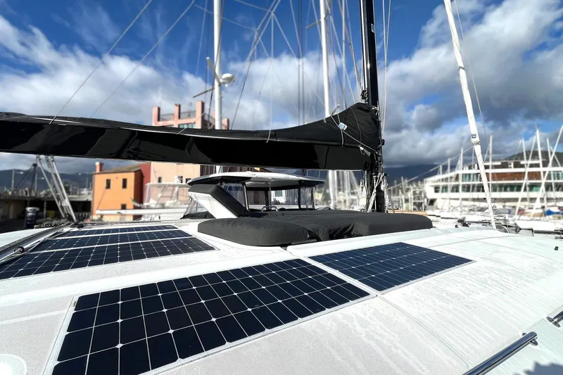  Yacht Photos Pics 2019 Lagoon 52 S catamaran with solar panels docked at marina.