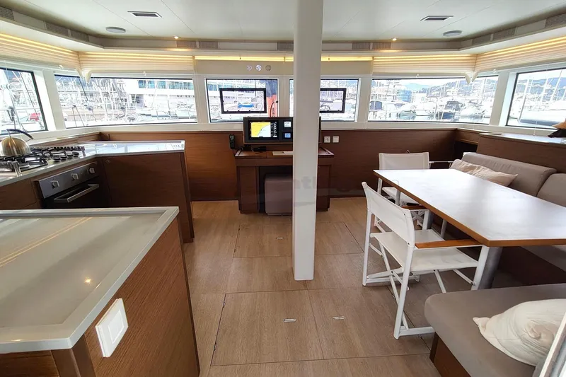  Yacht Photos Pics Interior of 2019 Lagoon 52 S yacht with modern kitchen and dining area.