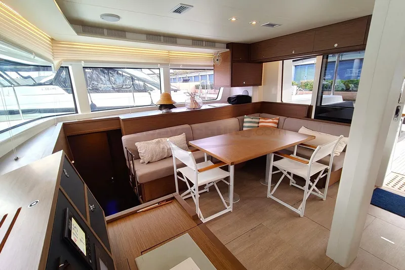  Yacht Photos Pics Interior of 2019 Lagoon 52 S yacht with dining area and modern decor.