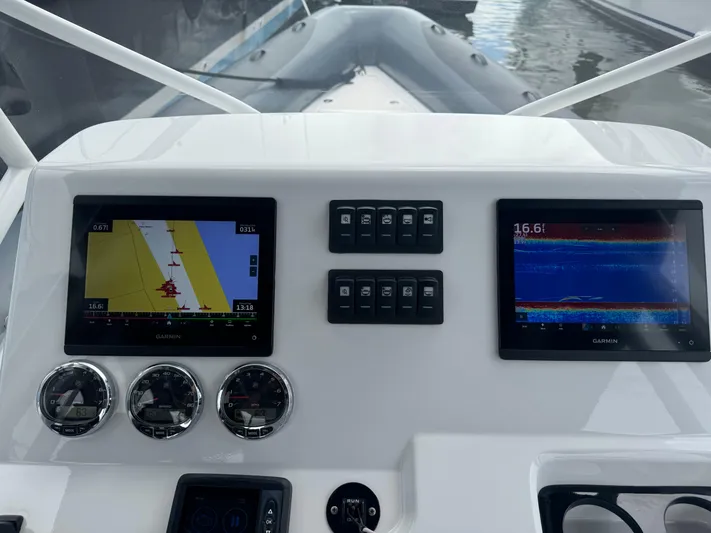  Yacht Photos Pics Boat dashboard with navigation screens and gauges, Iguana X100 model, 2021.