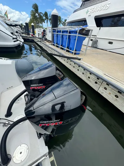  Yacht Photos Pics Docked boats with Mercury outboard engines at marina, clear sky, Iguana X100, 2021.
