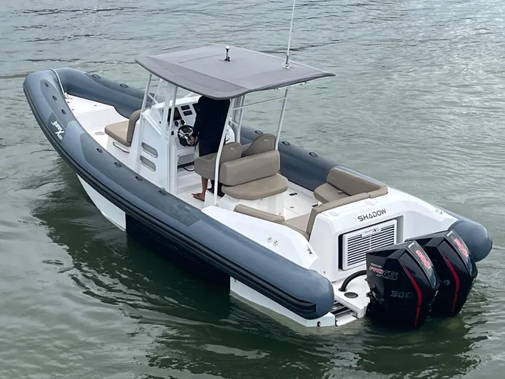  Yacht Photos Pics A 2021 Iguana X100 boat with dual engines on calm water.