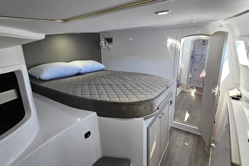  Yacht Photos Pics Interior of 2022 Seawind 1160 Lite catamaran with cozy bed and modern design.