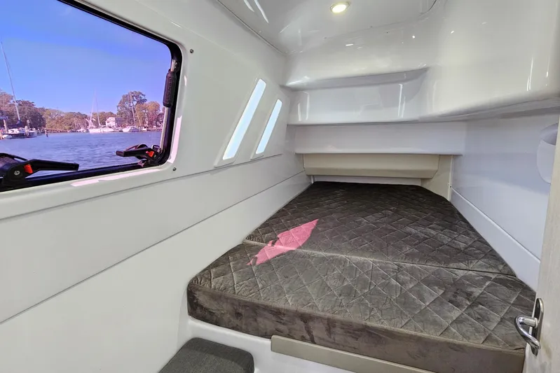  Yacht Photos Pics Cozy cabin interior of 2022 Seawind 1160 Lite catamaran with window view.