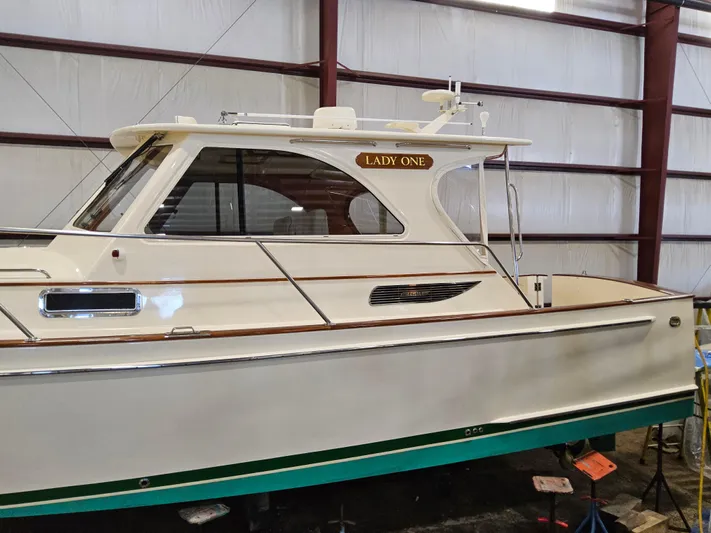 Lady One Yacht Photos Pics 2003 Legacy 40 Hardtop Express boat named "Lady One" in a storage facility.