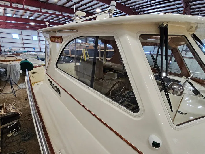 Lady One Yacht Photos Pics 2003 Legacy 40 Hardtop Express yacht in indoor storage facility.