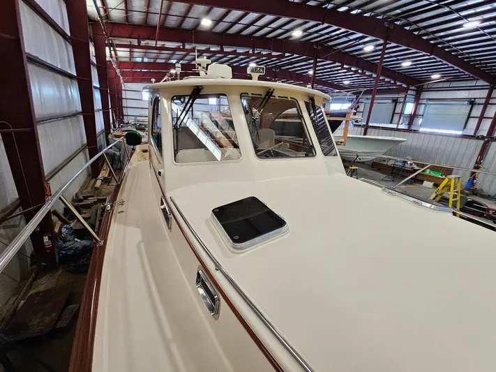 Lady One Yacht Photos Pics 2003 Legacy 40 Hardtop Express yacht in a spacious indoor storage facility.